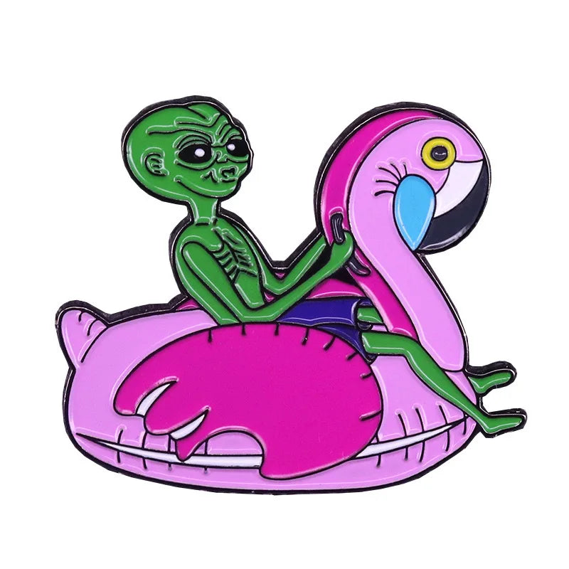 Pin's Alien sur flamand rose