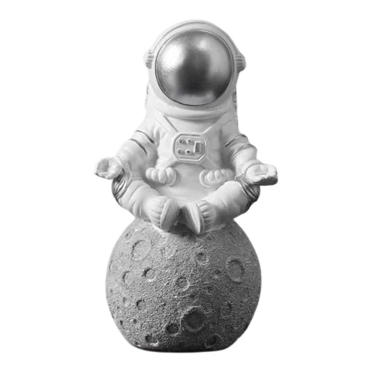 Figurine astronaute qui médite