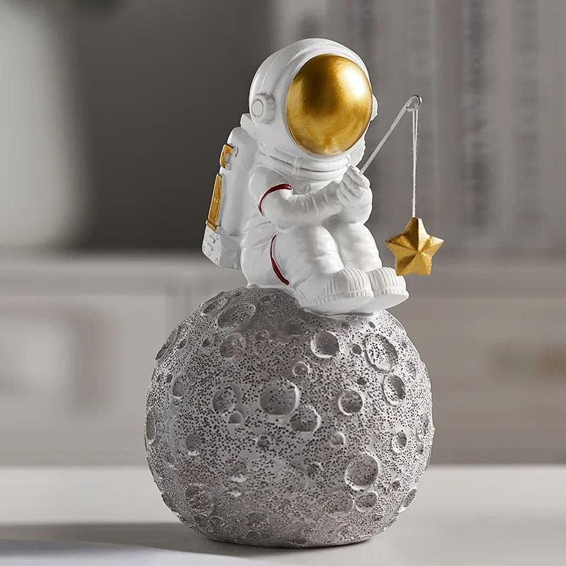 Fisherman astronaut statuette